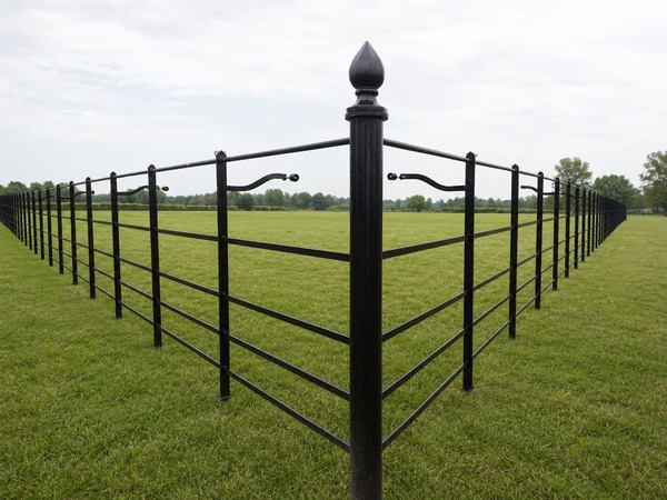 black-metal-fencing-around-large-field