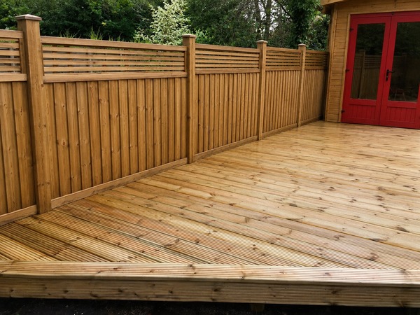 wooden-decking-fitted-in-back-garden