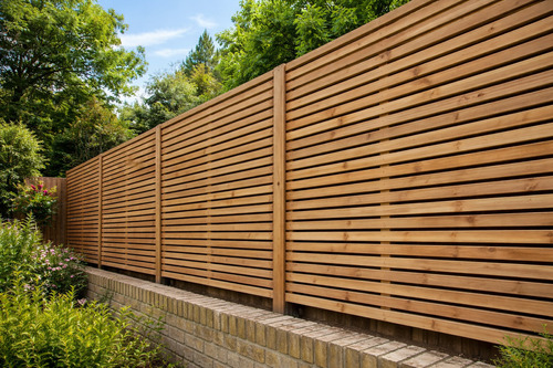 garden-fence-installation-on-top-of-a-wall