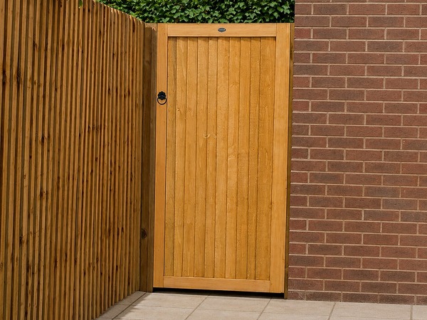 tanned-wooden-front-garden-gate-attached-to-brick-wall