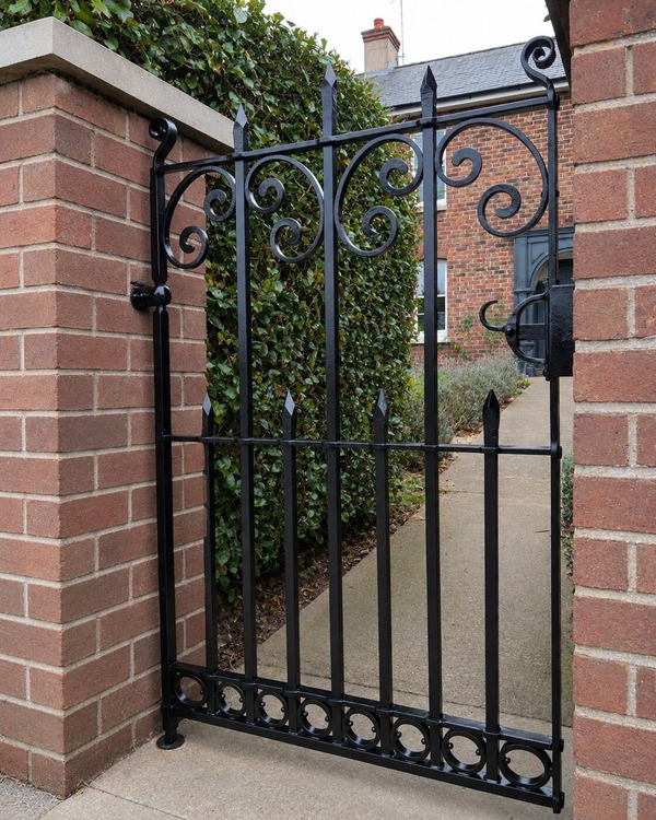 tanned-wooden-gate-and-fence-at-front-of-house
